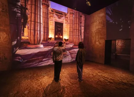 Two people walking in Egyptian temple